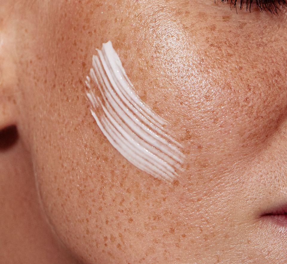 closeup of skincare lotion on the face